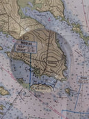 Nautical map with topographic details and a circular inset showing a different area.