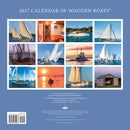 Calendar cover featuring images of wooden boats with a blue background