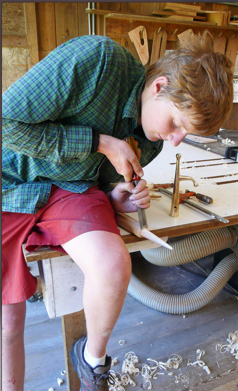 The multi-talented Milo S carves the pole for making an upstanding boathook