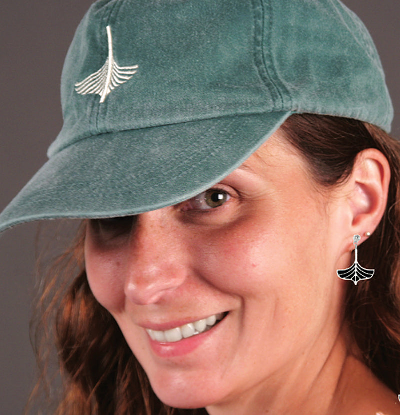 Kate sportint dangly earrings and a Spruce Green cap