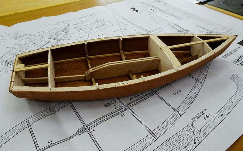 https://www.woodenboatstore.com/cdn/shop/products/Lightning-mid-build_800x.jpg?v=1669225752