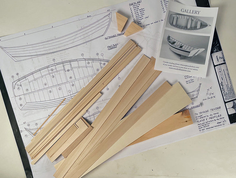 kit contents including plans, wood, and instructions